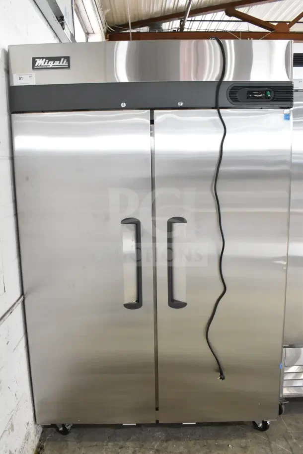 Brand new Migali C-2F-HC commercial 2-door reach-in freezer, 115V, 1 phase, with minor scratches and dents. Serial C-2F-HCPABC009.